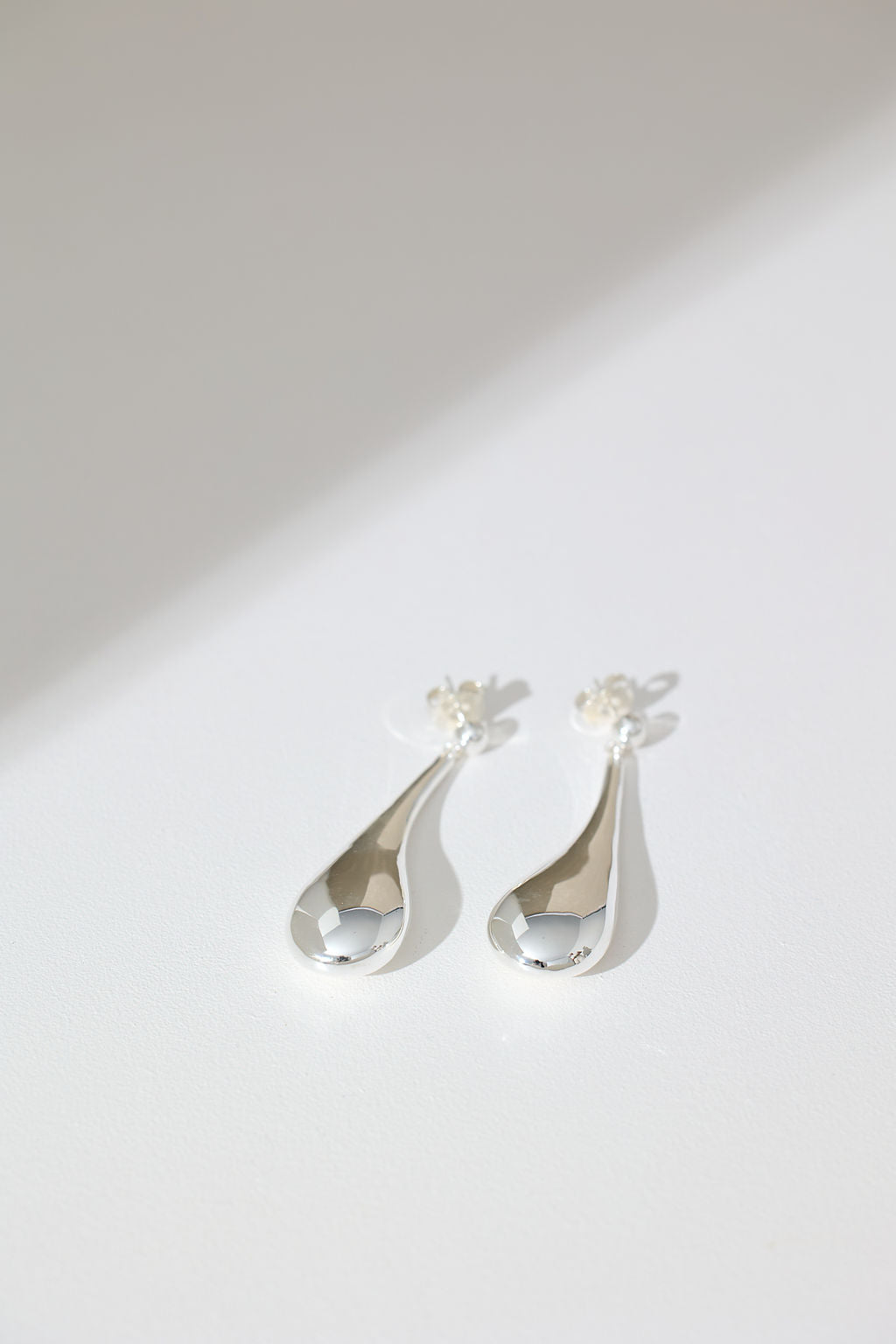 Long Hollow Form Tear Drop Earrings