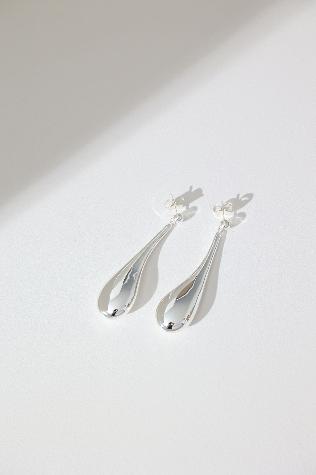Long Hollow Form Tear Drop Earrings