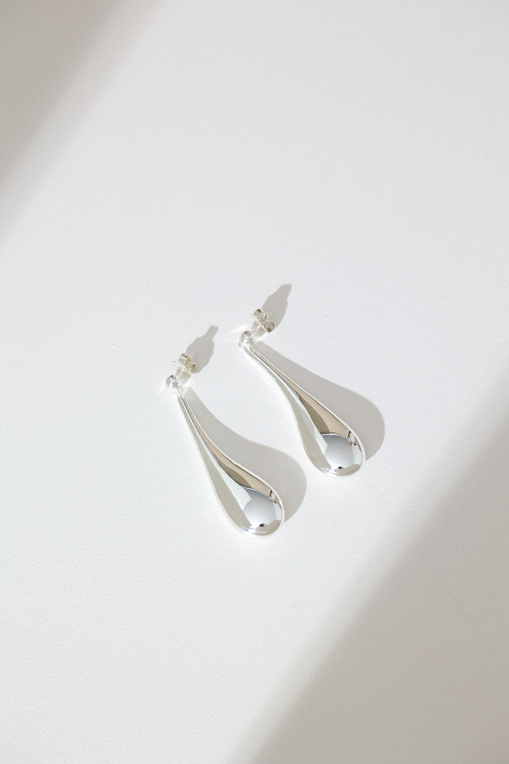 Long Hollow Form Tear Drop Earrings