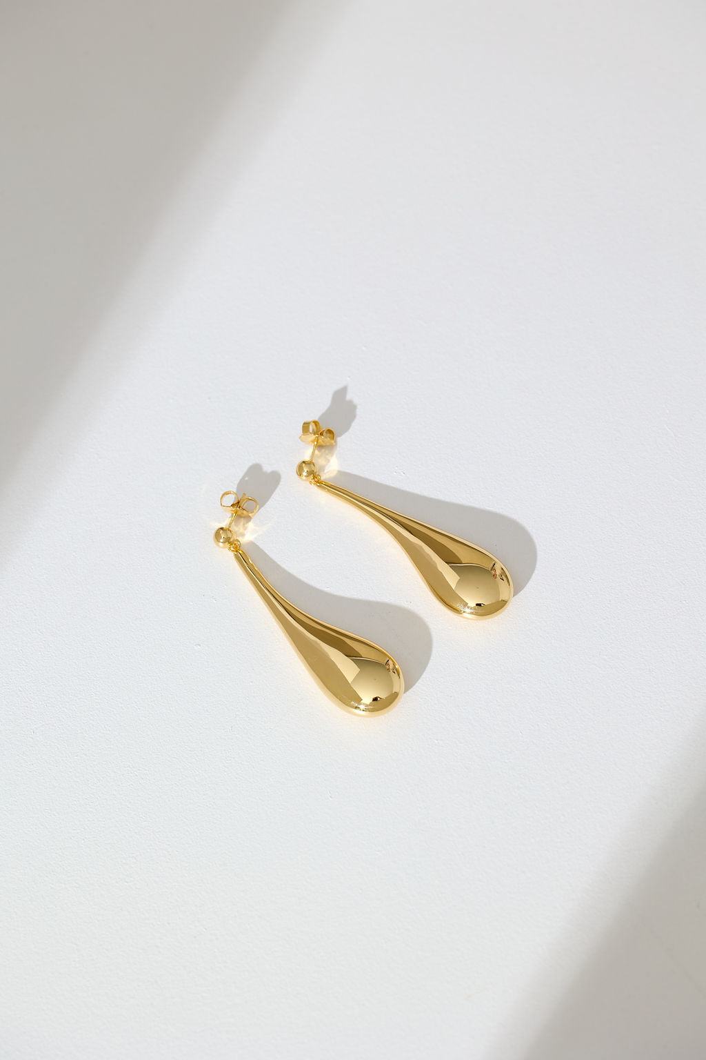 Long Hollow Form Tear Drop Earrings