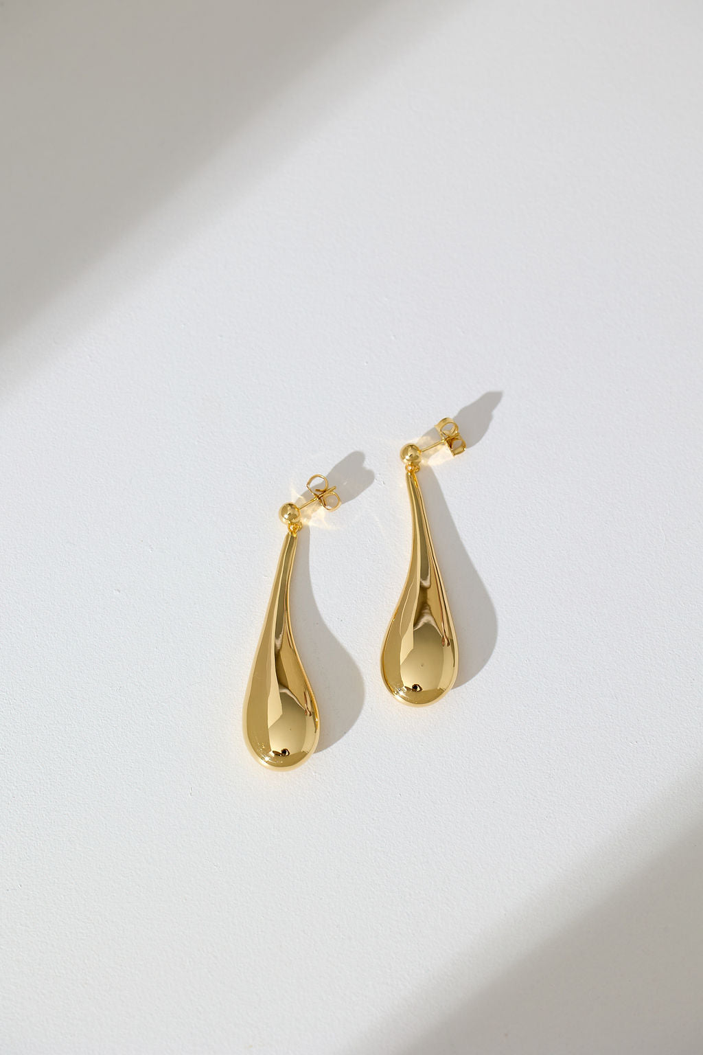 Long Hollow Form Tear Drop Earrings