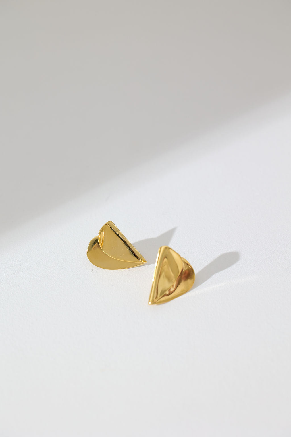 MEDIUM FOLDED HEART STUDS