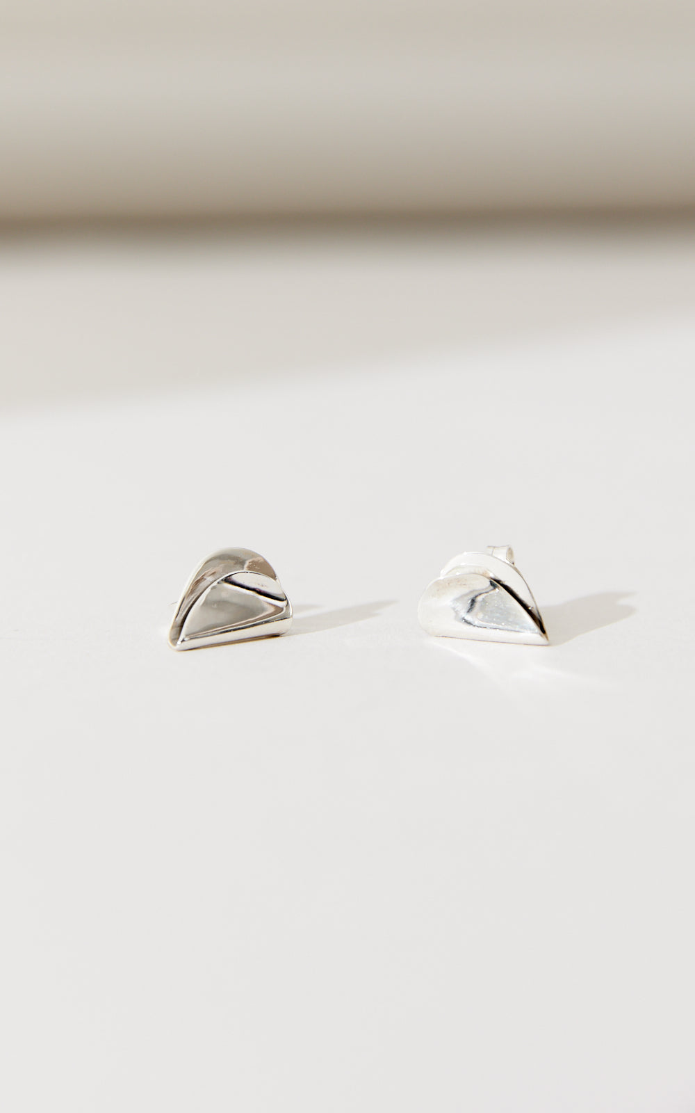 SMALL FOLDED HEART STUDS