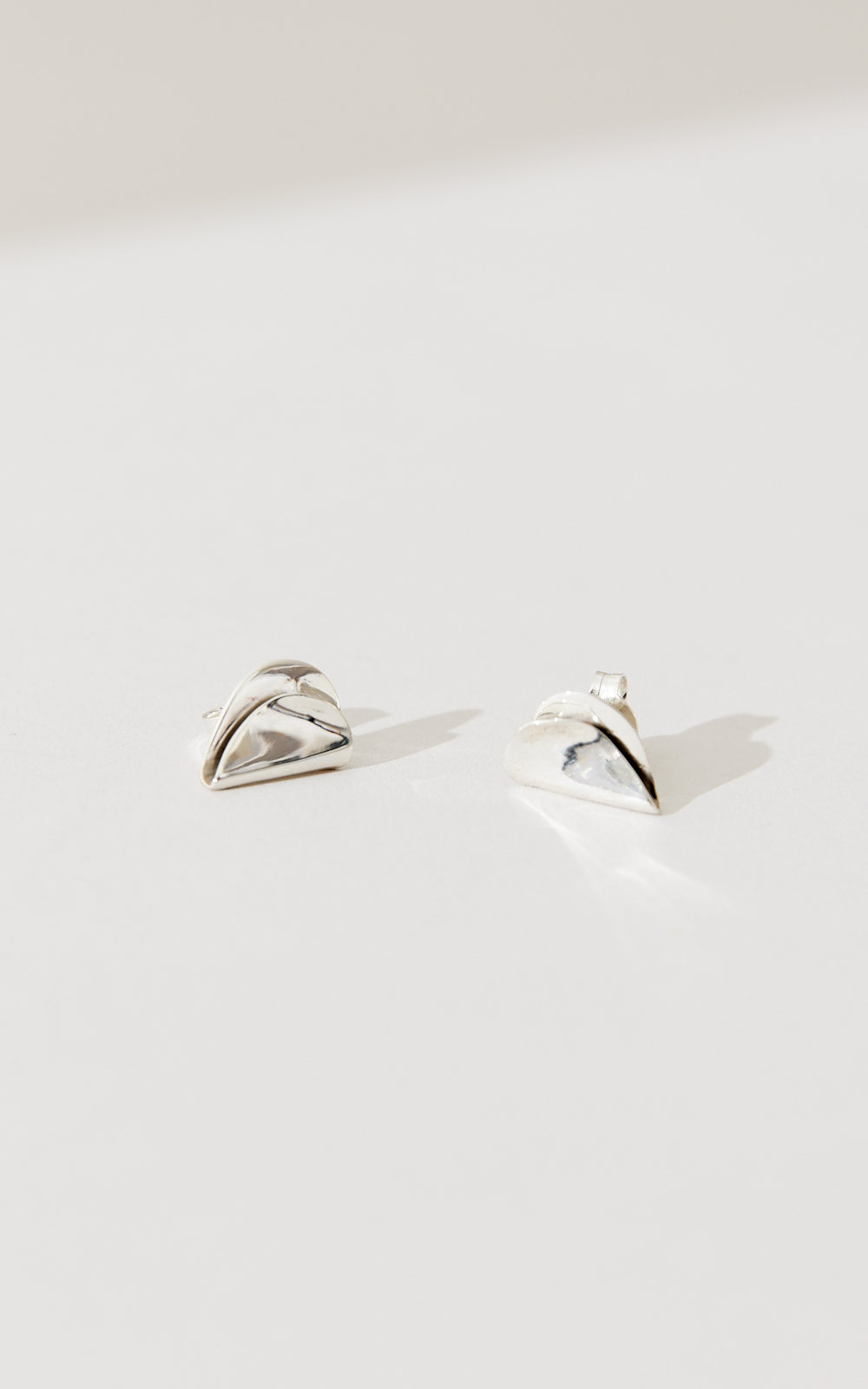 SMALL FOLDED HEART STUDS